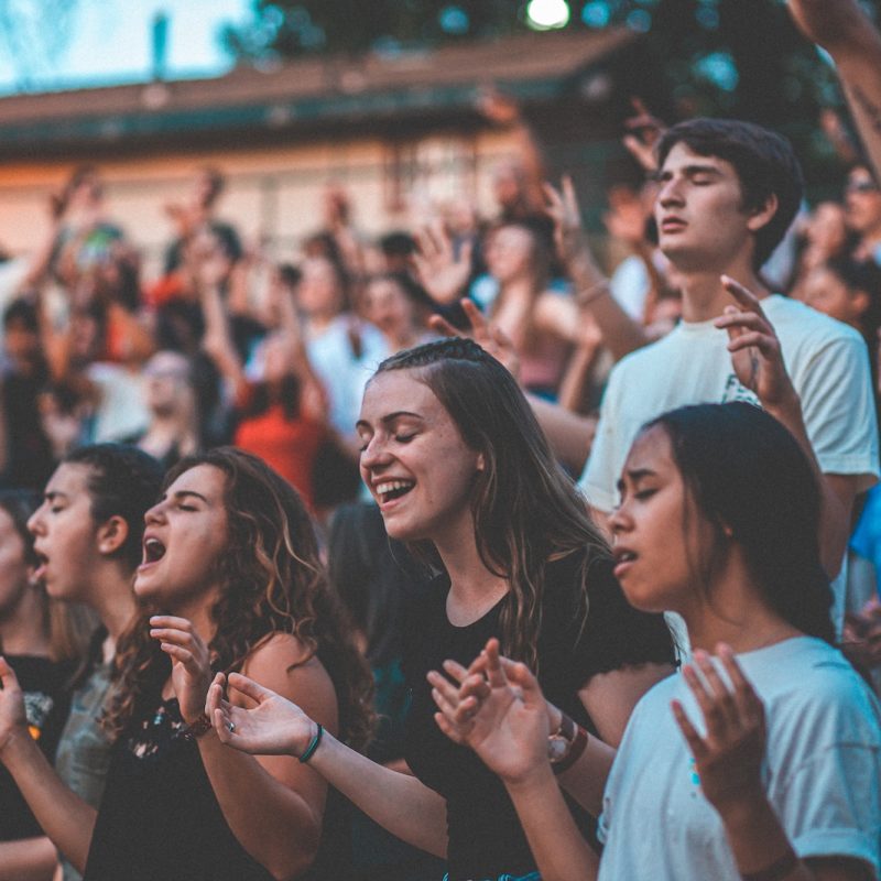 people cheering during day